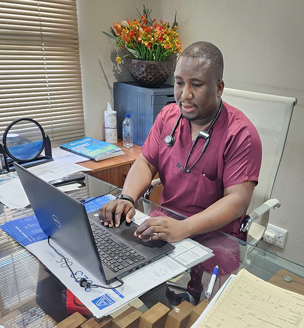 Dr Emmanuel Ati at his consulting desk